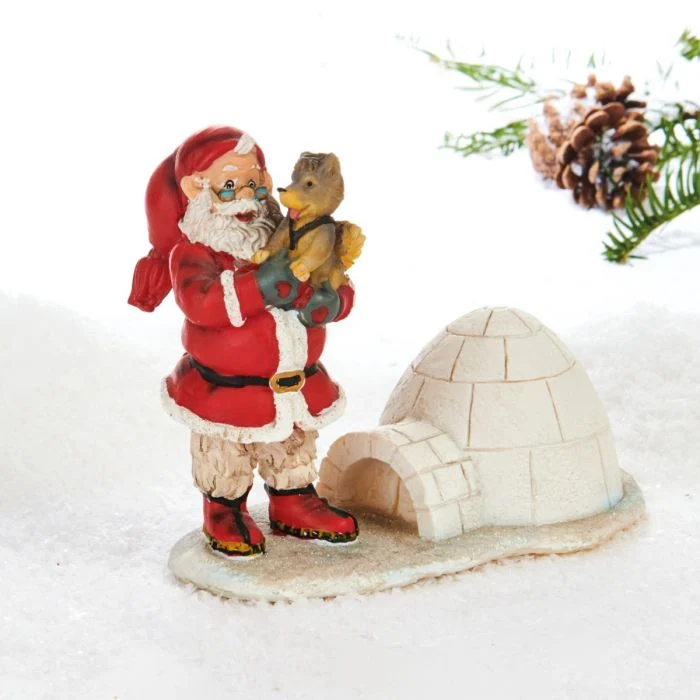 Jultomte med slädhund och igloo