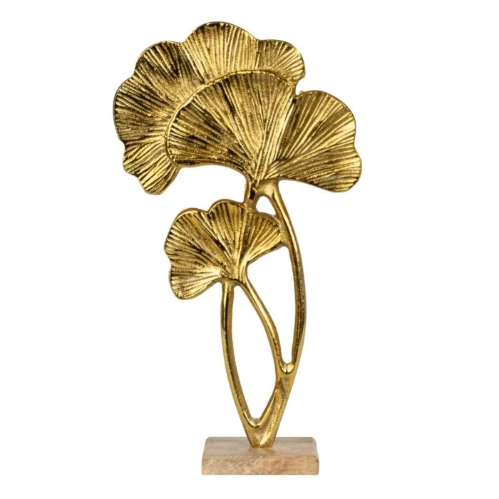 Skulptur med gyllene tropiska löv