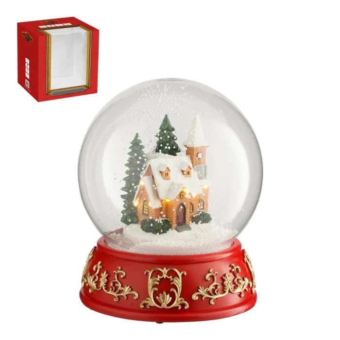 Snöglob med kyrka och skog