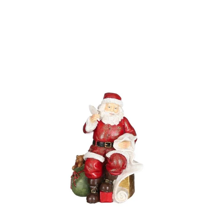 Jultomte med fjäderpenna och önskelista