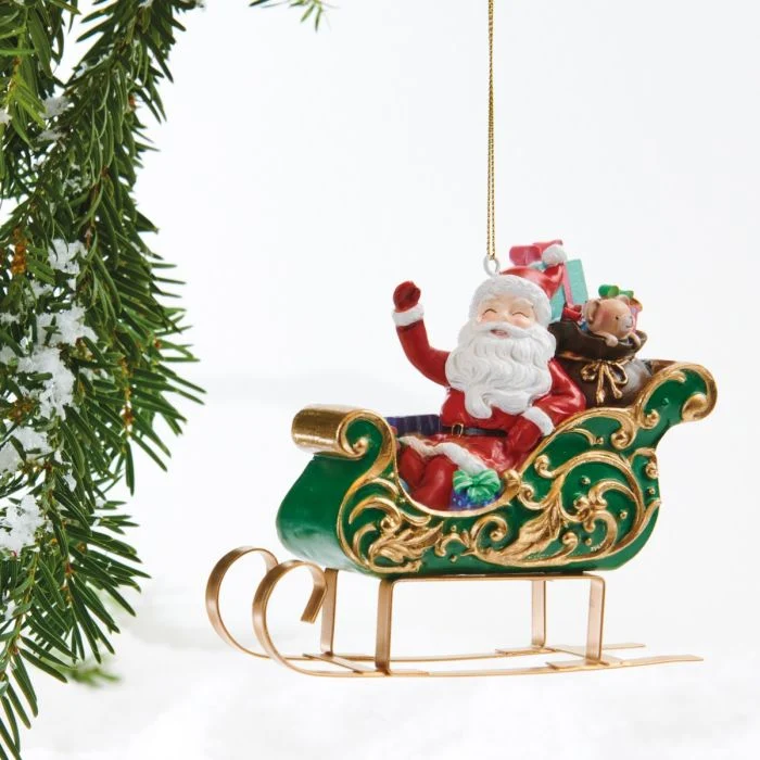 Jultomte i grön släde