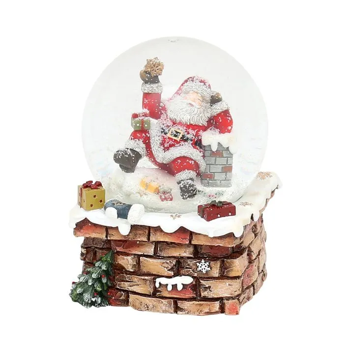 Snöglob med jultomte på skorsten